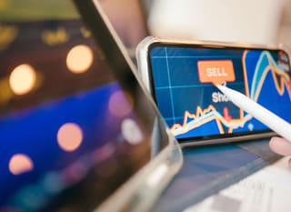Trader across multiple markets analysing Bitcoin Ethereum and forex options